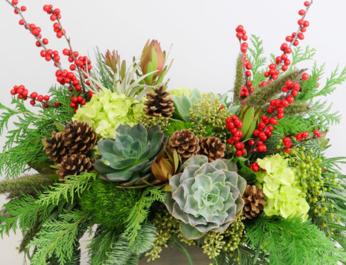 The marvelous floral designers at Allen’s Flowers have designed elegant Christmas centerpieces to adorn your dinner table