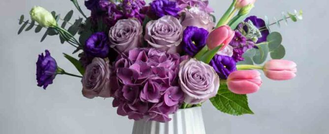 Soft, dreamy, and effortlessly elegant—Amethyst Dream is a floral arrangement designed to enchant. Featuring a luxurious mix of lavender roses, deep purple lisianthus, rich hydrangeas, and delicate pink tulips, this bouquet radiates sophistication. Accented with soft greenery and arranged in a modern white ceramic vase, it creates a serene and romantic display.